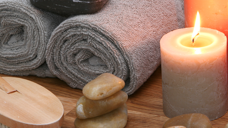 A still live of spa items, set up on solid oak, very soothing eartly colors,